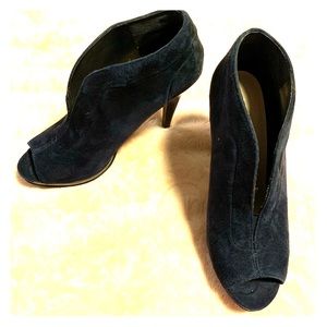 Navy peep-toe booties with heel.